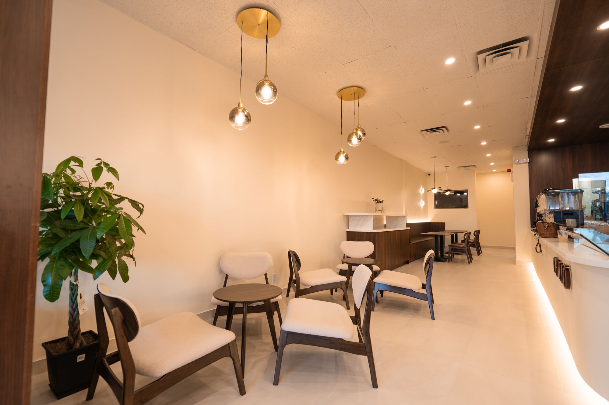 Inside Chillō café in Kanata — the counter, pendant lighting and window seating